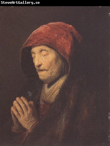 REMBRANDT Harmenszoon van Rijn An old woman at prayer (mk33)